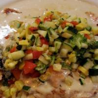Chicken with Poblano Cream Sauce · Grilled chicken breast smothered with our own chile poblano cream sauce. Served with white r...