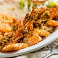 Camarones Al Mojo De Ajo · Prawns grilled and smothered with our own garlic sauce.