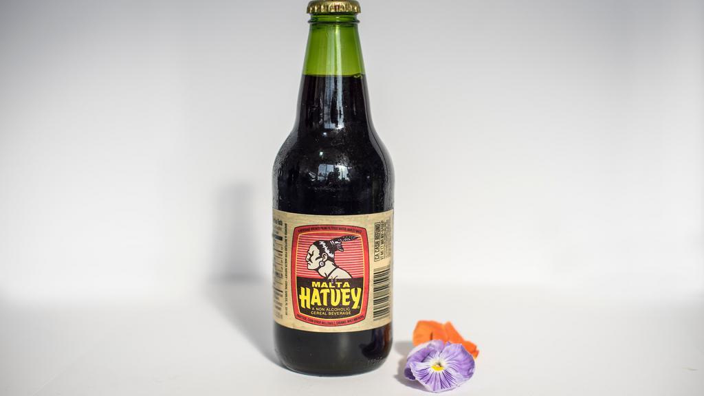 Hatuey Malta Drink · Malta is a lightly carbonated malt beverage, brewed from barley, hops, and water much like beer; corn and caramel color may also be added. It's the most popular Malta in the Caribbean. Malta is often described as being like a beer that has not been fermented.