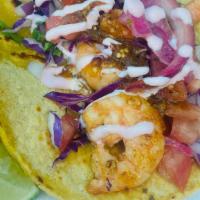 Shrimp Tacos · Onion, cilantro, salsa, guacamole sauce, cabbage, tomatoes, lime onions,baja cali sauce.