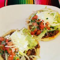 Sope (Single Sope) · Deep fried masa base topped with refried beans, your choice of meat, lettuce, pico de gallo,...