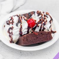 The Classic Brownie · Homemade chocolate brownie with vanilla ice cream, hot fudge, whipped cream & cherry.