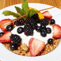 Granola Parfait · With berries and Greek yogurt.