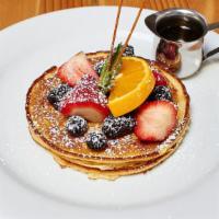 Lemony Ricotta Stack · Served with maple syrup and maple butter. Zesty lemon and ricotta pancake.