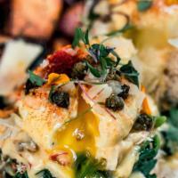 Oscar Benny · Poached eggs, fresh Dungeness crab meat, spinach, pimento, caper, meyer lemon hollandaise, a...