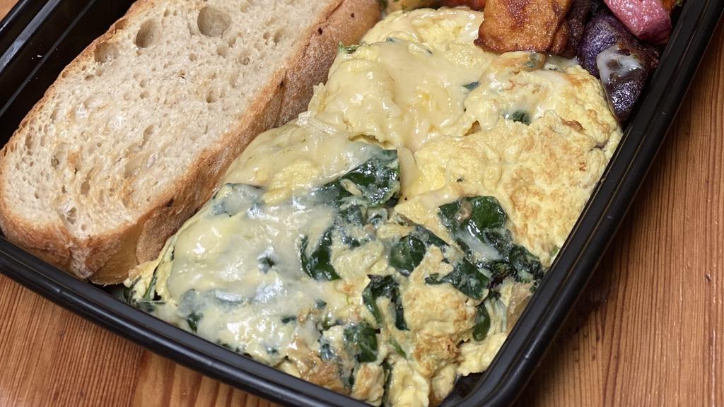 Snowed Spinach Scramble · Baby spinach with white cheddar.