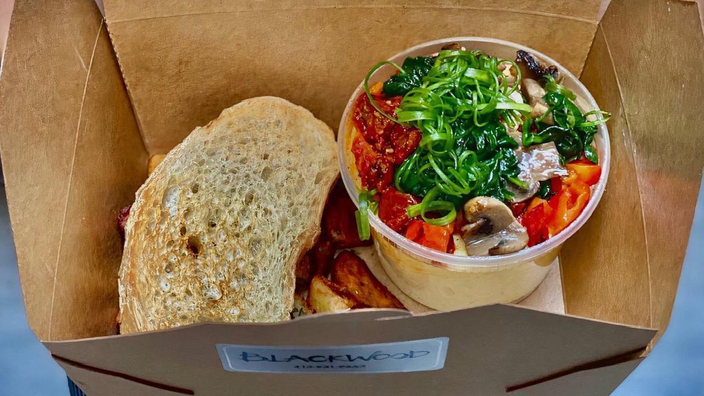 Gardenia Soufflegg · Soft steamed egg with sauteed mushroom, spinach, red bell, roasted tomatoes, green onion served with rainbow potatoes and ciabatta. Fluffy, delicious and wholesome!
