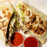 Large Special Quesadilla · Large wrapped flour tortilla with cheese, meat, sour cream, guacamole, lettuce, and pico de ...
