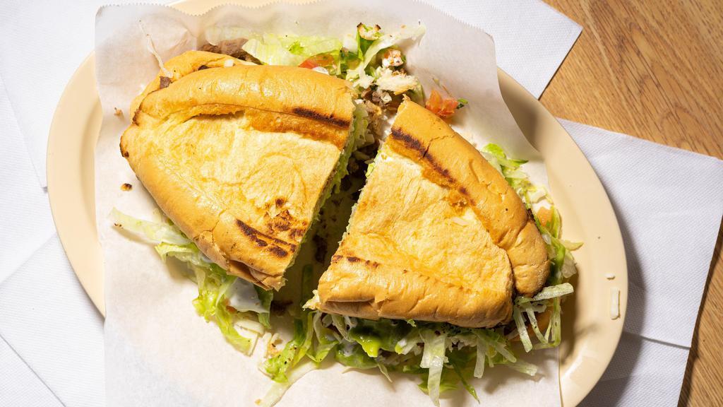 Torta/Mexican Sandwich · Torta Sandwich bread with meat, sour cream, guacamole, cheese, lettuce, pico de gallo salsa
