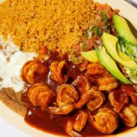 Camarones a la Diabla · Sautéed Shrimp with our home made spicey diabla sauce served with rice, refried beans, pico ...