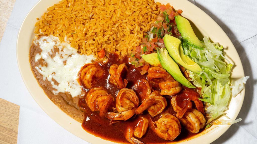 Shrimp Fajita Plate · Shrimp sautéed with onions, bell peppers, tomatoes and mushroom served with rice, refried beans, pico de gallo salsa, sour cream, guacamole, and lettuce with option of corn or flour tortilla.