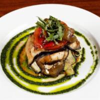 Caprino con Vegetali · Grilled layers of zucchini, eggplant, bell peppers, tomatoes, and Goat cheese in a pesto sau...