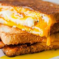 Breakfast Sandwich & Fruit · All-day classic Breakfast Sandwich with rashers of Bacon, two Sunny Side Up Eggs and cheddar...