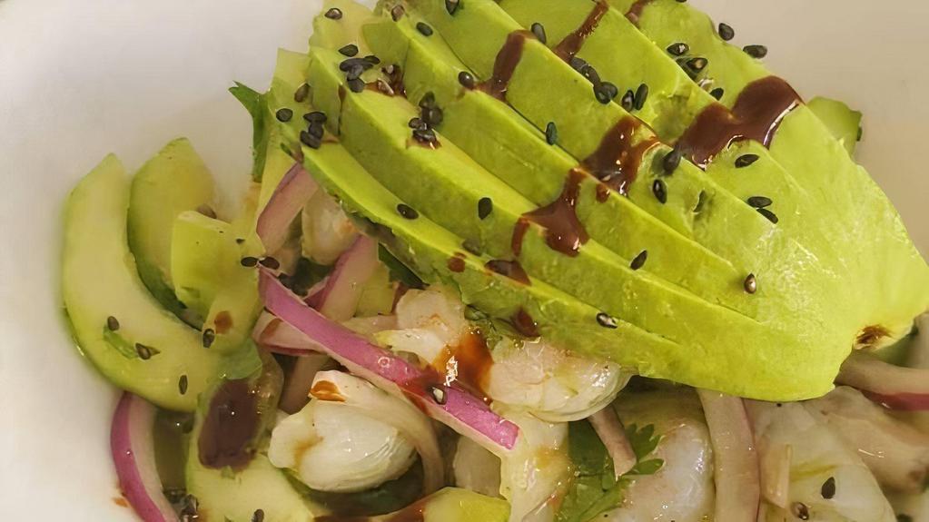 Aguachile Verde · Raw shrimp, cucumber, serrano pepper, avocado, cilantro, onions and green cucumber sauce.