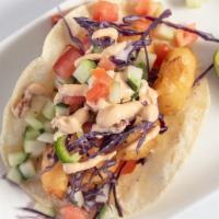 Baja Shrimp Taco · Breaded shrimp into corn tortilla topped with cabbage and cucumber pico de gallo and chipotl...