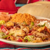 Alambres · Beef or chicken cooked with bell peppers, tomatoes, onions, bacon, and topped with cheese an...