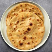 Tandoori Roti  · Whole wheat Indian bread cooked in a clay oven.