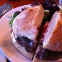 Turkey Burger · Served with garlic yogurt on a ciabatta roll with mixed greens and side of the day.
