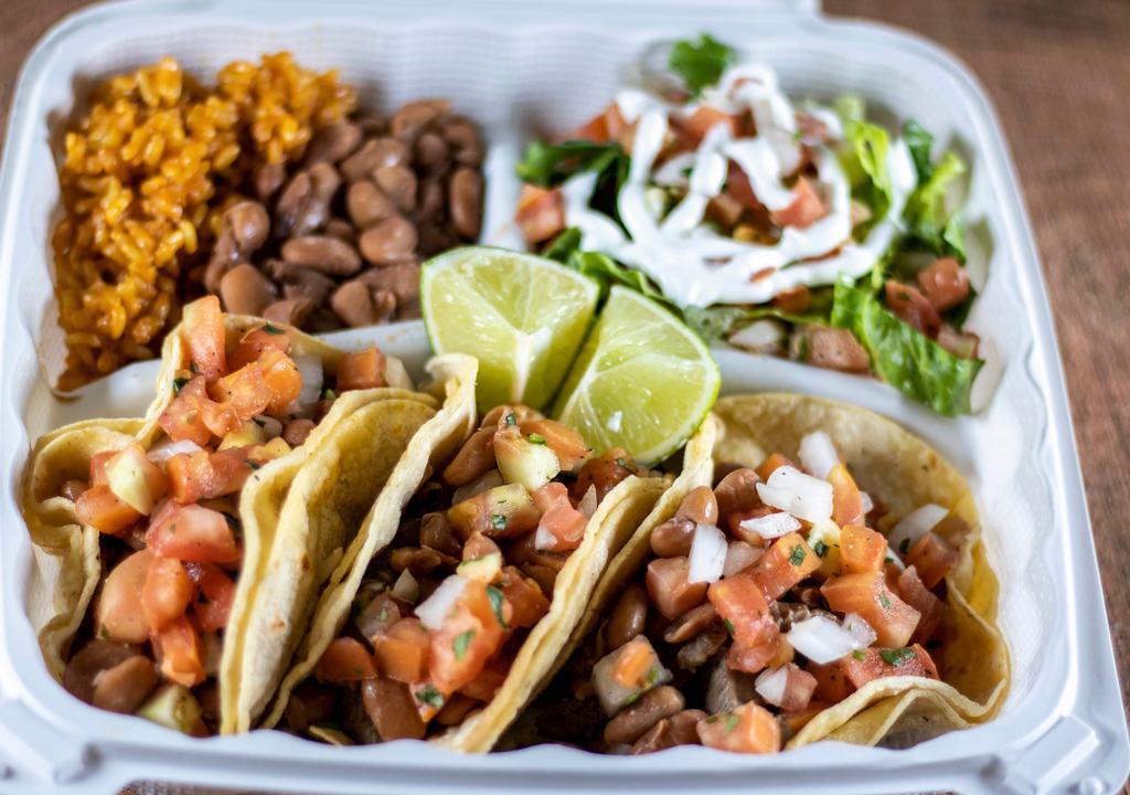 Taco Plate · 3 regular tacos, rice, beans, salad and chips.