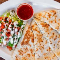 Quesadilla · Choice of meat, our blended cheese,onions and salsa.