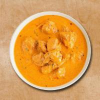 Ultimate Butter Chicken · Tender pieces of chicken are prepared in rich butter, cream, and tomato gravy.