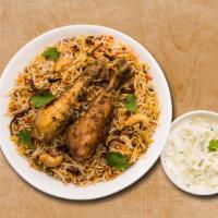 Chicken Biryani Theory · Aromatic rice cooked with chicken tenders, Indian spices, and herbs.  Served with raita and ...
