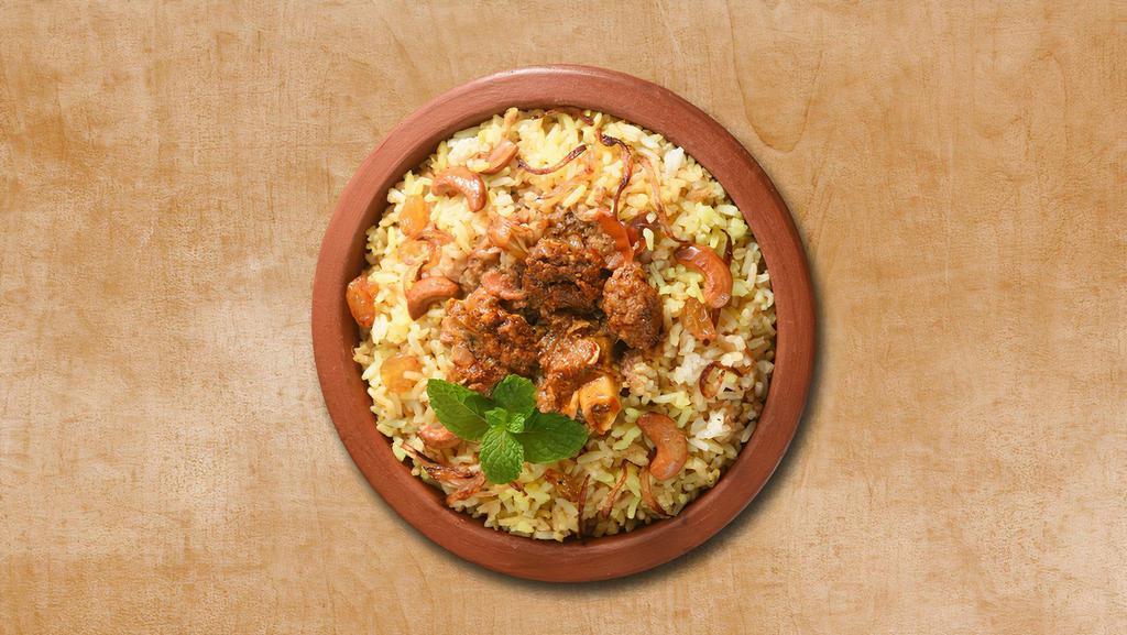 Lamb Biryani Theory · Aromatic rice cooked with pieces of lamb, Indian spices, and herbs. Served with raita and salan curry