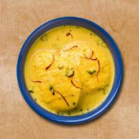 Supreme Rasmalai · Cottage cheese soaked in creamy water enrich with saffron.