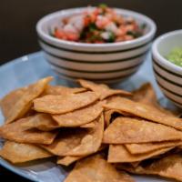 Guacamole and Chips · Fresh smashed avocados with onions, cilantro, lime juice, and house-made corn chips.