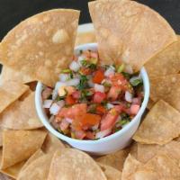 Fresh Salsa and Chips · Fresh diced tomatoes, onions, chopped cilantro, and lime juice are all mixed with house-made...