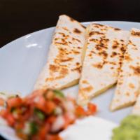 Cheese Quesadilla · Flour tortilla grilled with Monterey cheese, guacamole, fresh salsa, and sour cream on the s...