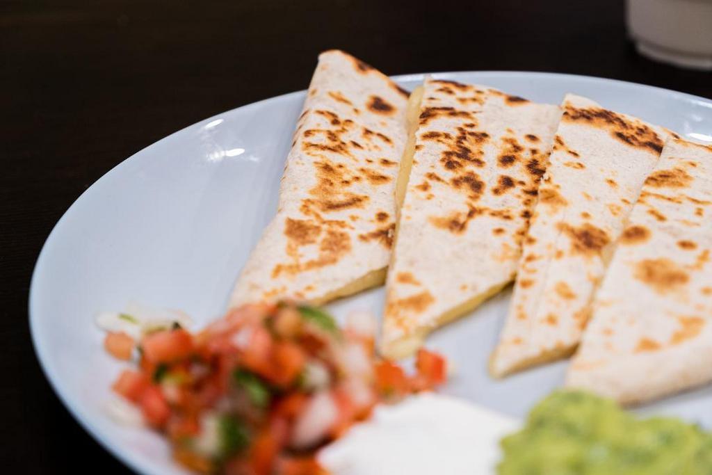 Cheese Quesadilla · Flour tortilla grilled with Monterey cheese, guacamole, fresh salsa, and sour cream on the side. Complimentary salsas on the side.