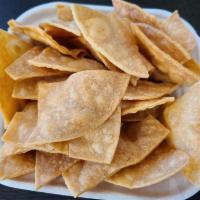 House-made Chips · Fresh corn tortilla cut daily and slow fried.