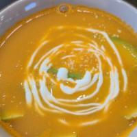 Tortilla Soup · Ancestral recipe called Sopa Tarasca is made with pinto beans, fresh tomatoes, guajillo chil...