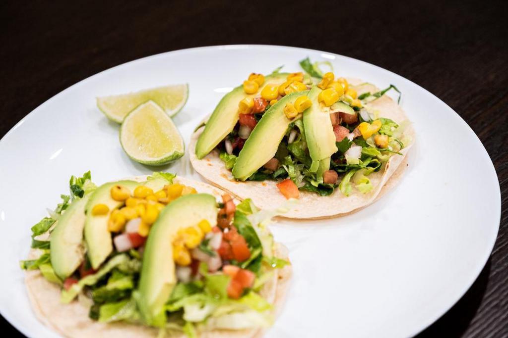 Avocado Taco · Corn o Flour tortilla filled with avocado and topped with lettuce, fresh salsa, and grilled corn with salsas of your choice.