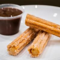 Churros and Dipping Chocolate · 3 Churros tossed in sugar and cinnamon served with a signature melted.