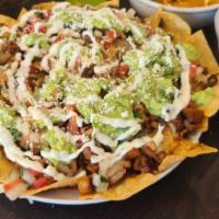Cheese and Meat Nachos · Our daily House-made Chips with your Choice of Protein, and Beans with melted Monterrey Chee...