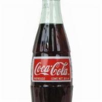 Mexican Bottled Glass Coca-Cola · Mexican Coke uses natural cane sugar, and even if it has the same number of calories and rea...