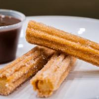 Churros and Dipping Chocolate · 3 Churros tossed in sugar and cinnamon served with a signature melted chocolate.