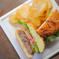 Classic Cheeseburger · 1/2 pound of beef, cheddar cheese, lettuce, tomato, onion, pickles, basil mayo. Served with ...