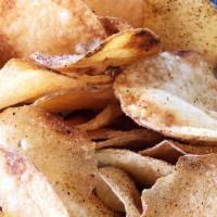 Crisps · Housemade thin sliced potato chips with secret spice rub.