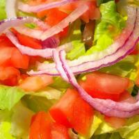 Side Salad · Lettuce, tomato, onions and house-made dressing.