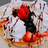 Very Berry Waffle · Topped with strawberries, blueberries, blackberries and cranberries.