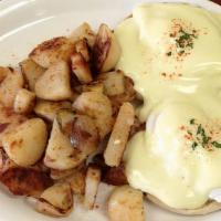 Eggs Benedict · Canadian bacon, poached eggs and hollandise sauce on English muffin.