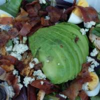 Cobb Salad · Organic spring mix, turkey, bacon, petite tomatoes, hard-boiled egg and avocado with blue ch...