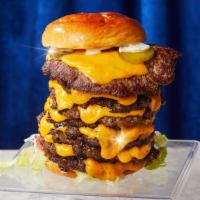 10 Patty Burger · Take the challenge! Ten smash burger patties with cheddar cheese, lettuce, tomatoes, onion, ...