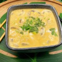 Tom Kha (Coconut Milk Soup) · Thai style coconut milk soup with mushrooms, tomatoes, galangals, lemon grass, kaffir lime l...