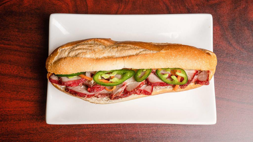 M3. BBQ Pork Sandwich / Bánh mì thịt xá xíu nướng · Red Xa xiu Pork. Oven roasted and sliced. Sweet and savory