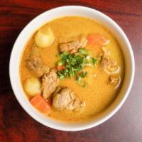 C6. Curry Chicken / Cơm cà ri ga · Over steamed rice.