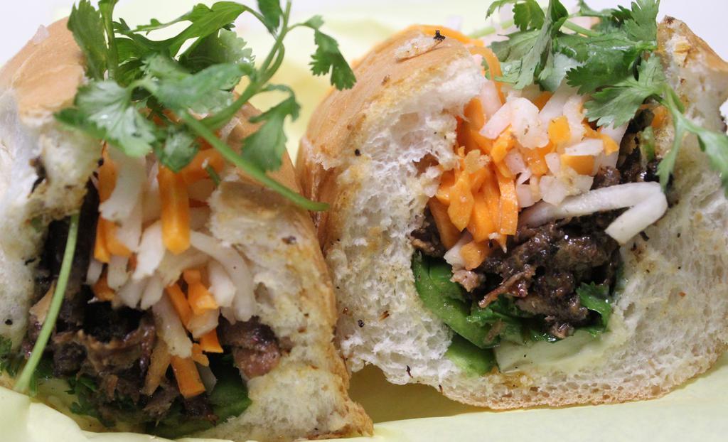Grilled Pork - Banh Mi Thit Nuong · Sweet and savory grilled pork on a fresh French baguette! With Vietnamese mayo, jalapenos cilantro, pickled daikon, and carrot!